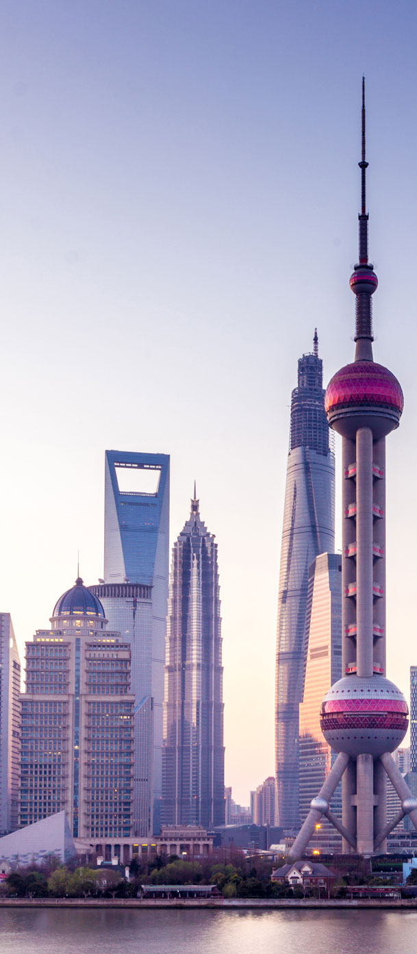 Shanghai’s Pudong skyline at dusk showing sky scrapers that adapt to winds and weather.